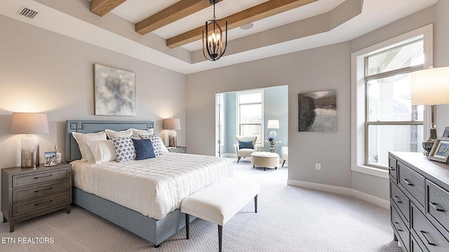 carpeted bedroom with beamed ceiling and a chandelier