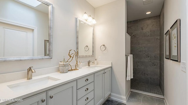 bathroom featuring vanity and tiled shower