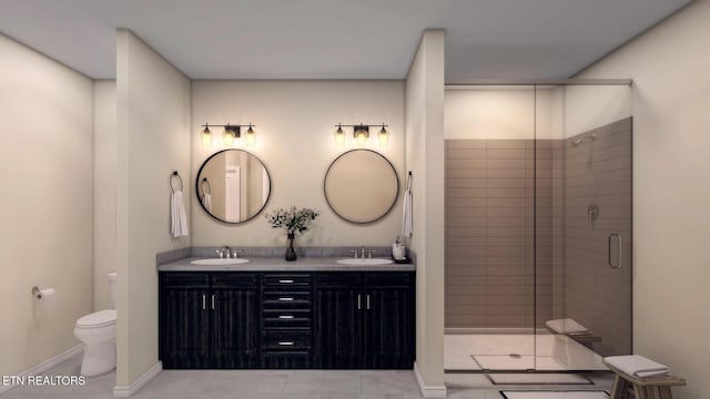 bathroom with vanity, a shower with shower door, and toilet