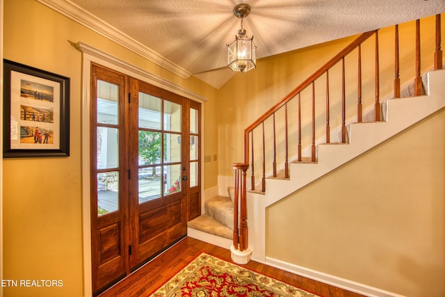 105 Charity Ln, Jamestown, TN 38556 - foyer featuring stairs, dark wood-style floors, a textured ceiling, and crown molding