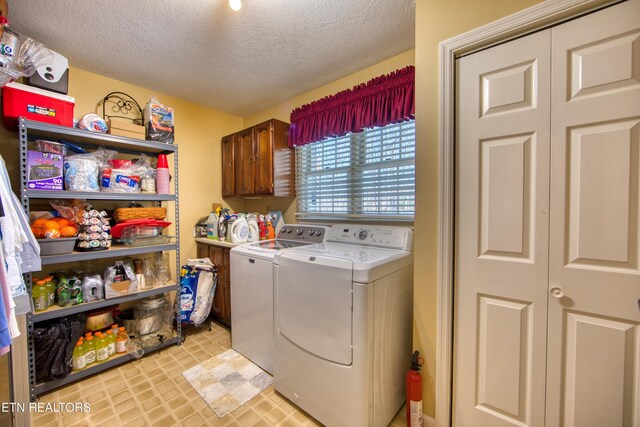 105 Charity Ln, Jamestown, TN 38556 - laundry area with separate washer and dryer, a textured ceiling, and cabinet space