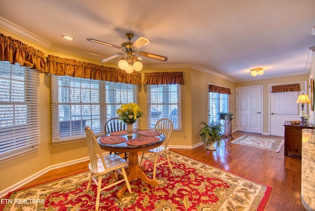 105 Charity Ln, Jamestown, TN 38556 - dining room featuring crown molding, wood finished floors, a ceiling fan, baseboards, and a textured ceiling