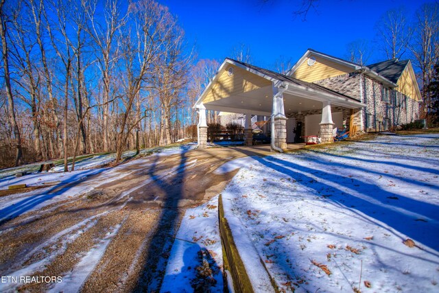 105 Charity Ln, Jamestown, TN 38556 - view of snow covered exterior with brick siding