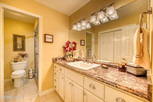 105 Charity Ln, Jamestown, TN 38556 - full bath featuring vanity, toilet, tile patterned floors, baseboards, and a shower with shower curtain