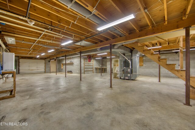 105 Charity Ln, Jamestown, TN 38556 - unfinished basement featuring heating unit and stairs