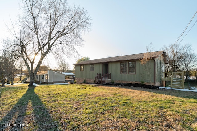 back of house with a yard