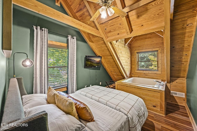 bedroom with vaulted ceiling with beams, ceiling fan, dark wood-type flooring, and wooden ceiling