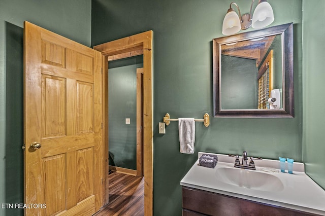 bathroom featuring hardwood / wood-style floors and vanity