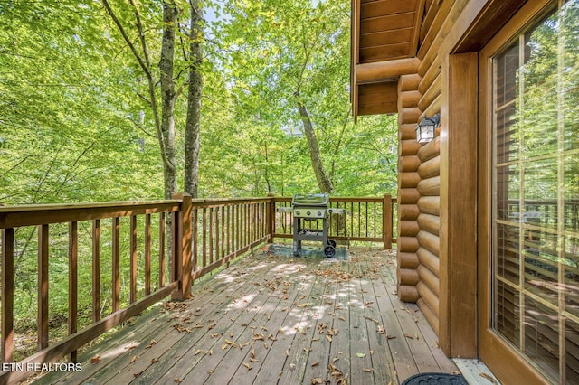 wooden terrace featuring grilling area