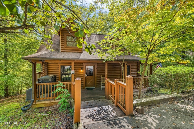 exterior space with covered porch and central AC