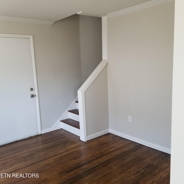 stairs featuring hardwood / wood-style floors and crown molding