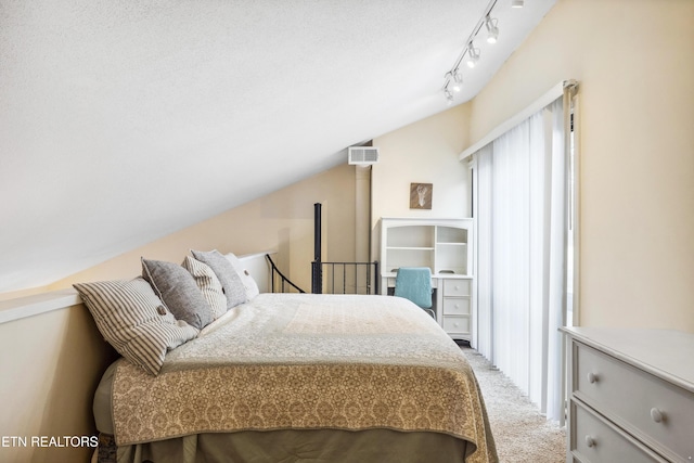 carpeted bedroom featuring vaulted ceiling