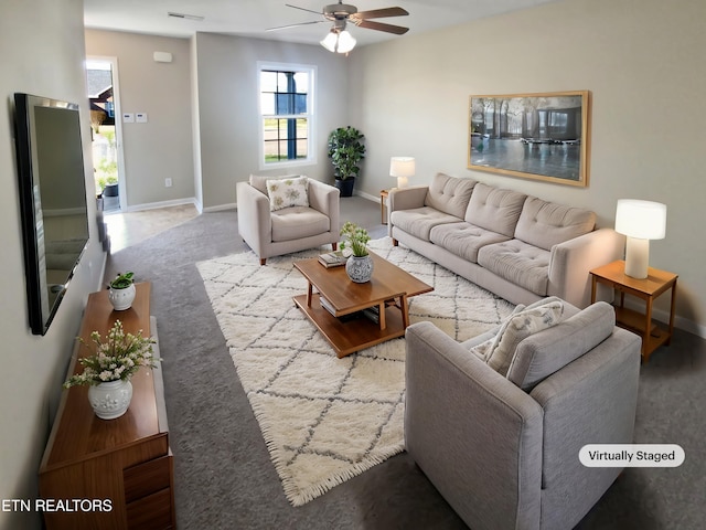 living room featuring ceiling fan and carpet floors