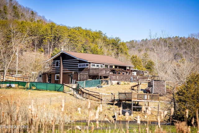 rear view of property with a deck