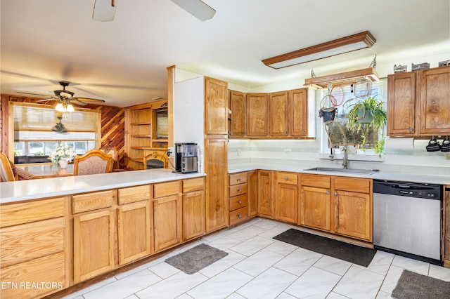 kitchen featuring sink, stainless steel dishwasher, ceiling fan, tasteful backsplash, and kitchen peninsula