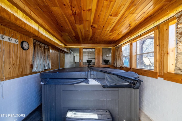 view of swimming pool with a hot tub