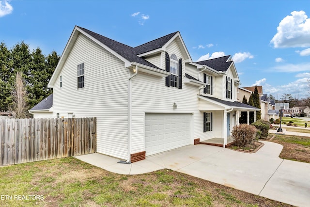 view of property exterior featuring a garage and a yard