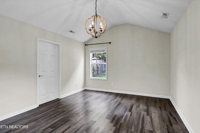 empty room with a chandelier, dark hardwood / wood-style floors, and vaulted ceiling