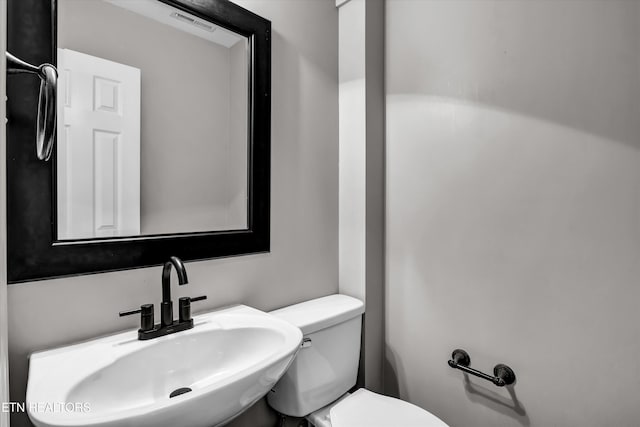 bathroom with toilet and sink