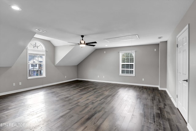 bonus room with ceiling fan, lofted ceiling, and dark wood-type flooring