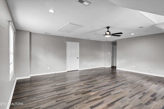 spare room featuring ceiling fan and dark hardwood / wood-style floors