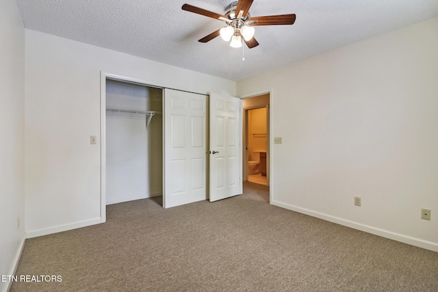 unfurnished bedroom featuring ceiling fan, carpet floors, a textured ceiling, and a closet