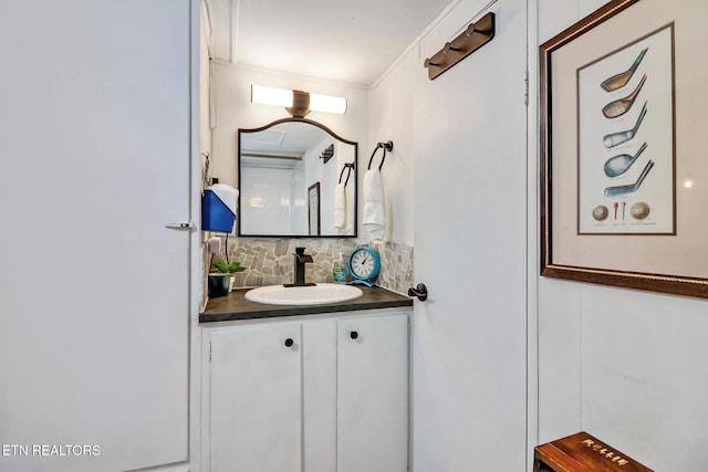 bathroom featuring decorative backsplash and vanity