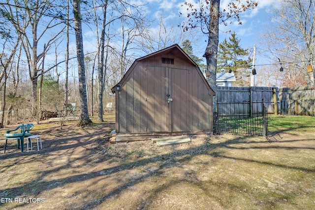 view of shed with fence