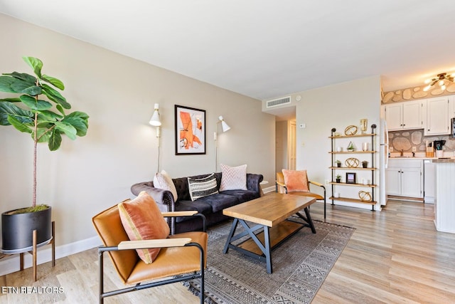 living room with light hardwood / wood-style floors