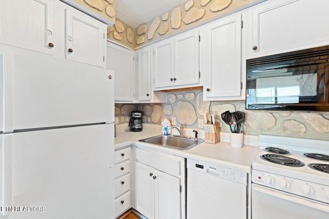 kitchen with backsplash, sink, white cabinets, and white appliances