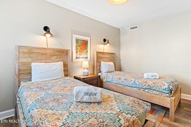 bedroom featuring hardwood / wood-style flooring