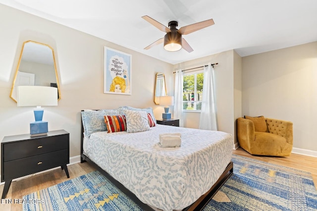 bedroom featuring ceiling fan and hardwood / wood-style flooring