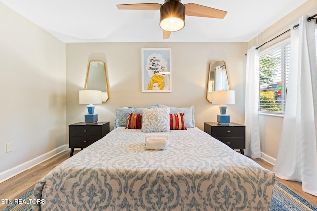 bedroom with hardwood / wood-style floors and ceiling fan