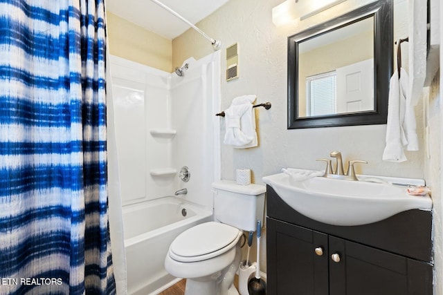 full bathroom with vanity, shower / bath combination with curtain, and toilet