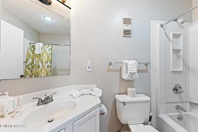 full bathroom with vanity, shower / bath combo, and toilet