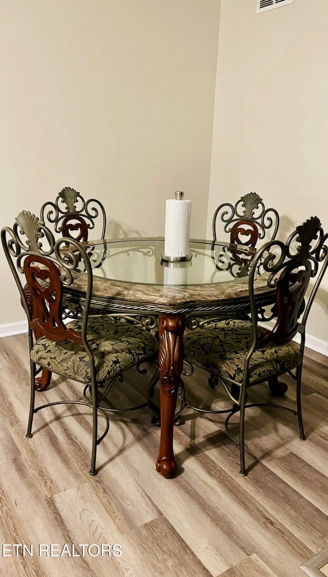 dining room featuring light hardwood / wood-style floors