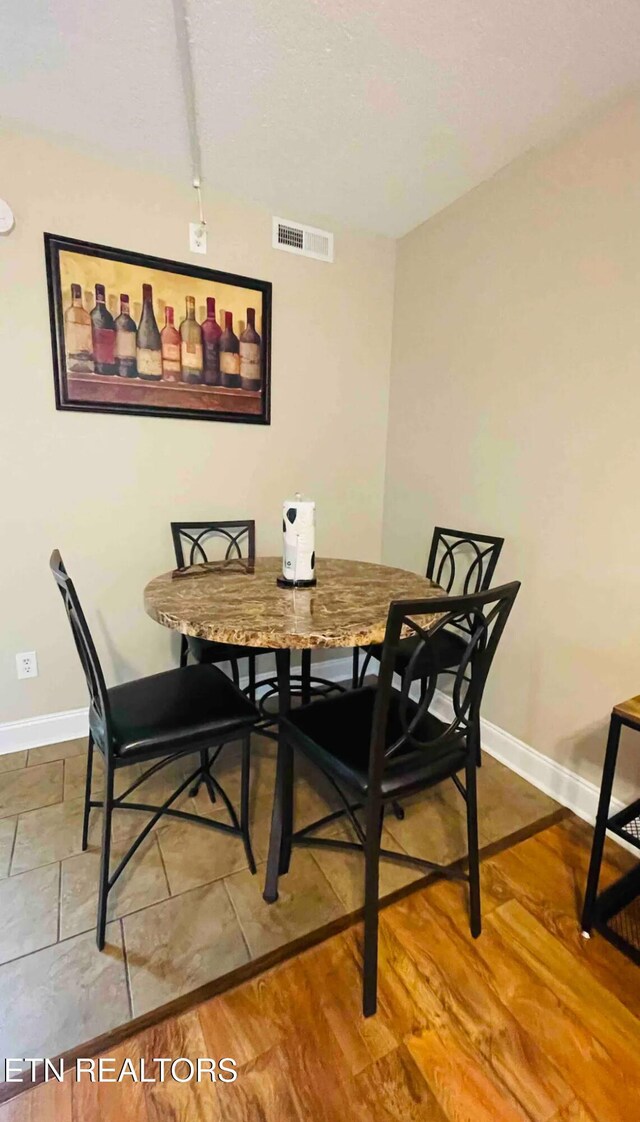 dining space featuring hardwood / wood-style floors