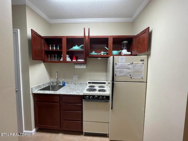 kitchen featuring a textured ceiling, crown molding, white appliances, and sink