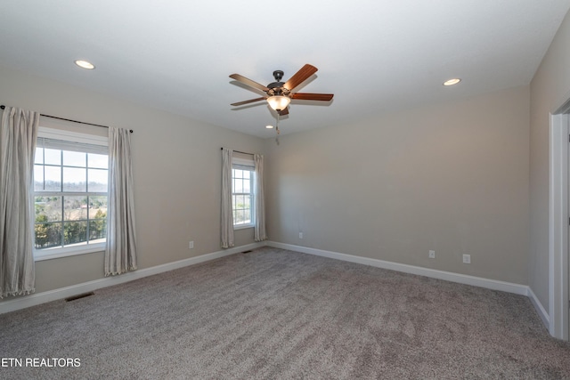 carpeted spare room with baseboards, visible vents, ceiling fan, and recessed lighting