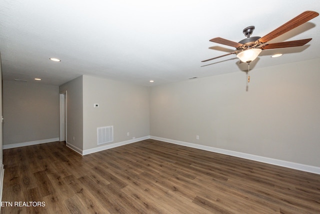 spare room with recessed lighting, wood finished floors, visible vents, and baseboards