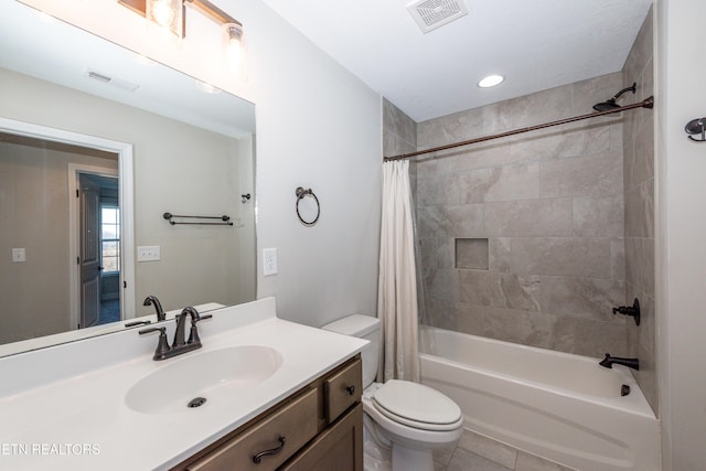 bathroom featuring visible vents, shower / bathtub combination with curtain, toilet, and vanity