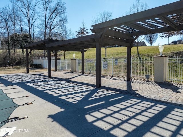 view of patio with fence and a pergola