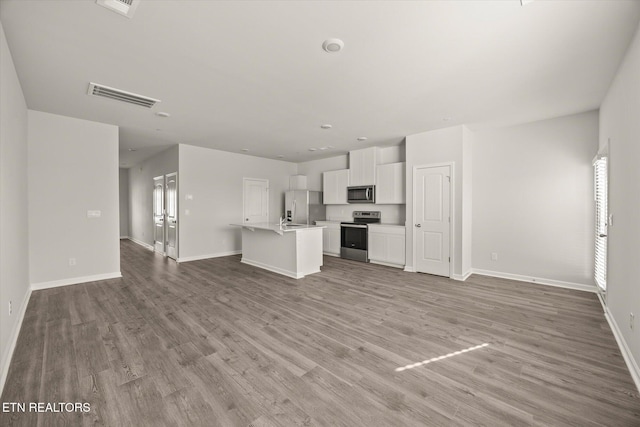 unfurnished living room featuring light wood-type flooring