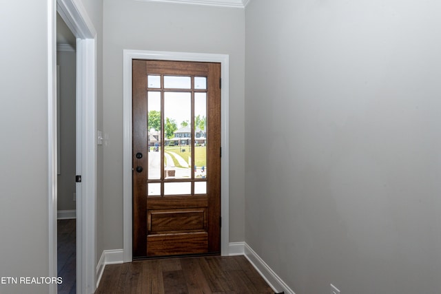 doorway to outside with dark wood-style flooring and baseboards