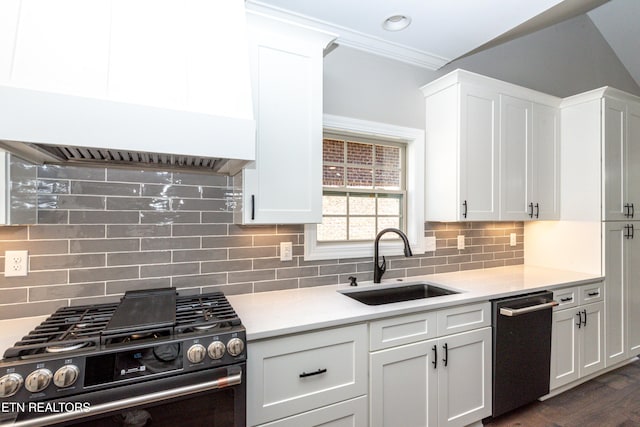 kitchen featuring light countertops, white cabinets, range with gas cooktop, dishwashing machine, and a sink