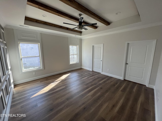 unfurnished bedroom featuring ceiling fan, a tray ceiling, and dark hardwood / wood-style flooring