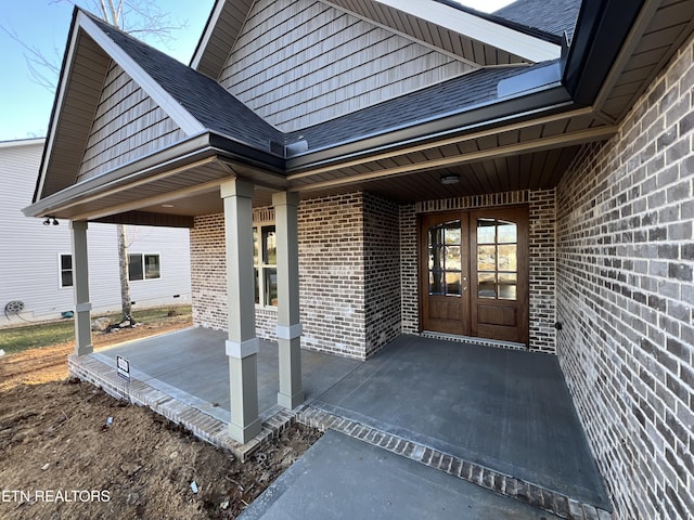 doorway to property with french doors and a porch