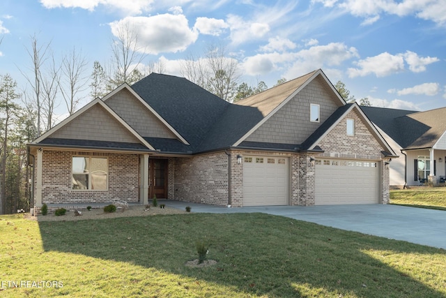 view of front of home with a garage, brick siding, driveway, and a front yard