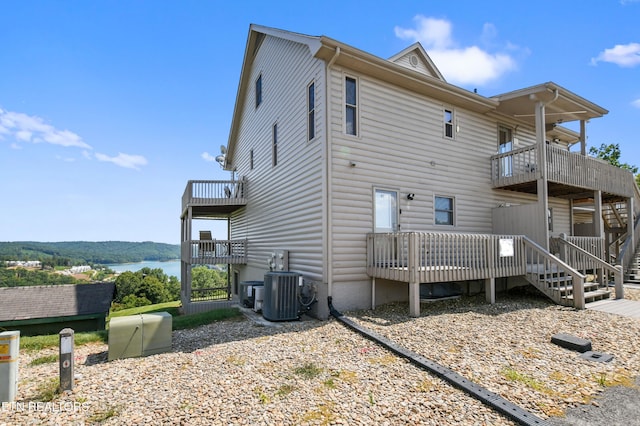 back of property featuring central AC and a balcony