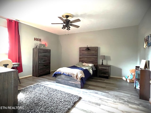 bedroom featuring ceiling fan and wood-type flooring